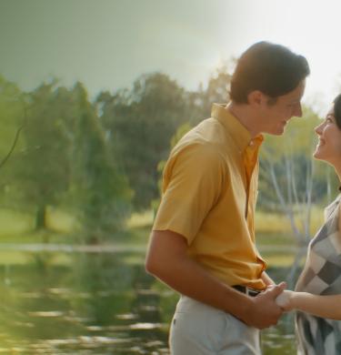 The Blind cast holding hands by the river